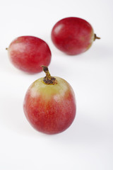 three red grape on white background