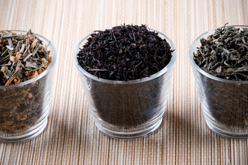 three kinds of dry tea in glasses