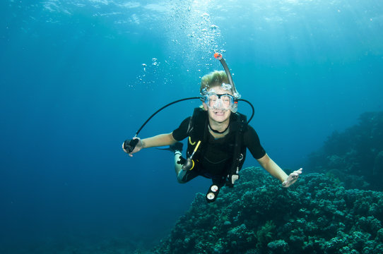 young boy has fun on a scuba dive