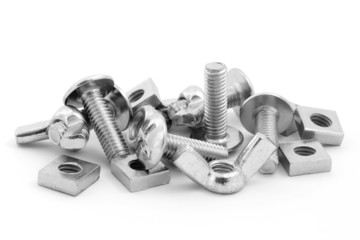 Pile of nuts and bolts over white