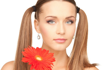 Fototapeta premium lovely woman with red flower