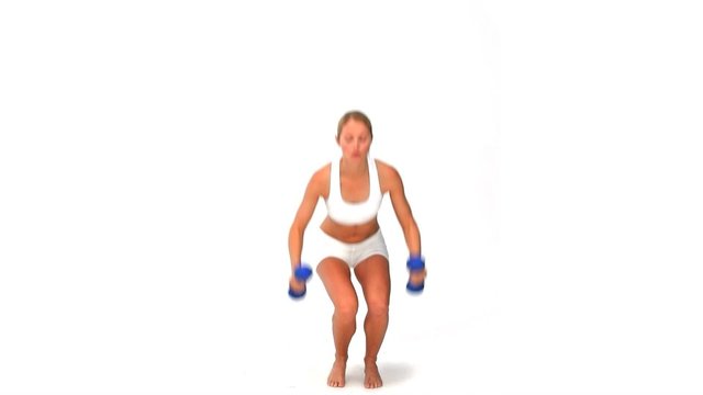 Dynamic blond woman with dumbbells