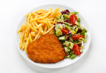 Pork chop, French fries and vegetables