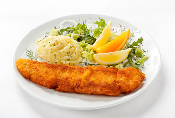Fried fish fillet, mashed potatoes and vegetables