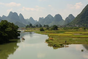 Gordijnen Chinese landscape of Yangshuo with river and water meadows © jjspring