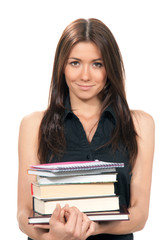 Young woman holding books, notepads in her hands