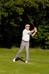 Senior golf player in summer
