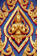 Fototapeta na wymiar Thai lord Statue on the wall