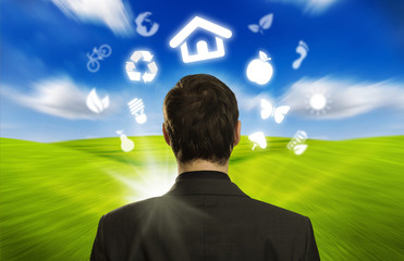businessman with ECO icons floating around his head