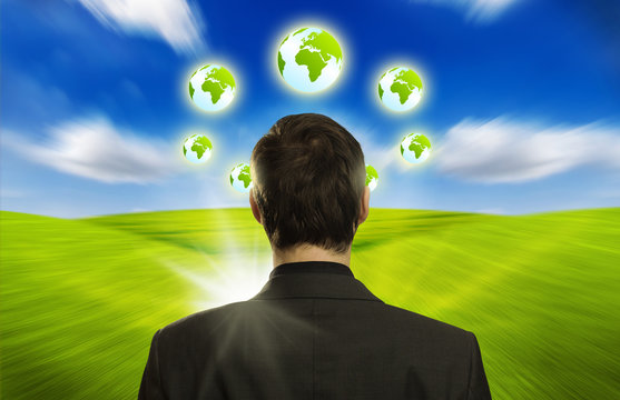 businessman with ECO icons floating around his head