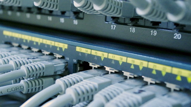 hand plugging  cable in network switch 1080i 25FPS