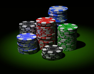 Gambling chips in piles. On black background.