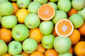 Orange and green apple fruit on market