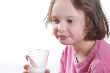 Portrait of a  girl drinking a glass of milk