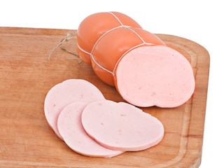Meat delicatessen on the board isolated on the white