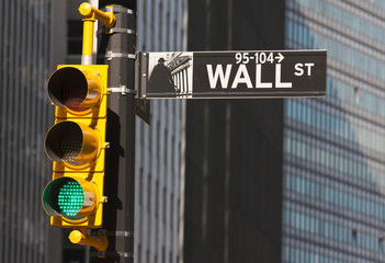 Wall street sign and traffic light