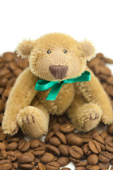 teddy bear with a bow and coffee beans