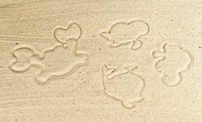 Fototapeta na wymiar Footprint of plastic beach toy on sand