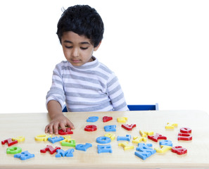 Preschooler Identifying Alphabets and Numbers