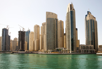 Naklejka na ściany i meble Town scape at summer. Panoramic scene, Dubai.