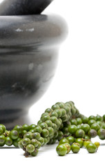 Green peppercorns with mortar