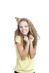 young smiling woman in birthday hat over white