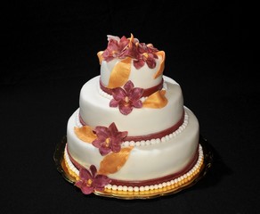 three layer wedding cake decorated with flowers