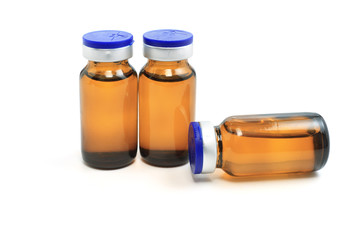 three glass bottles with medicine