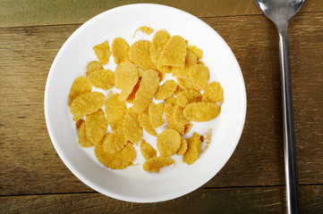Cornflakes and milk  in bowl
