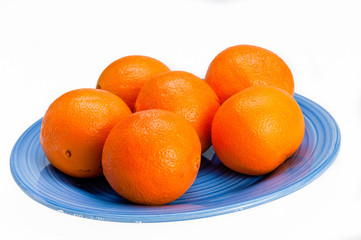 Blue plate with six oranges