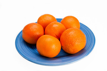 Blue plate with six oranges