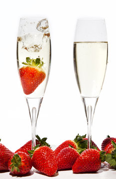 Strawberries Splashing into a glass of Champagne