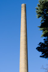 Chimney against the blue sky.