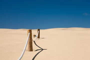 Foto op Canvas cord barrier in desert © Red-Blue Photo