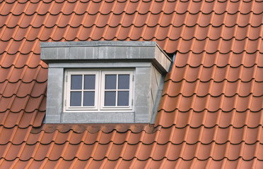 Roof with red tiling and dormer