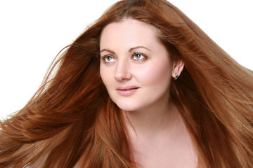 Portrait of a girl with red, long hair