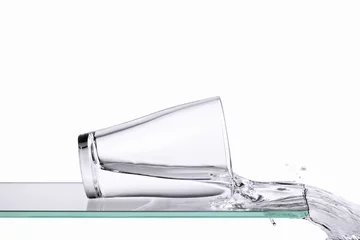 Fototapeten Spilling glass of water © Daniel Täger