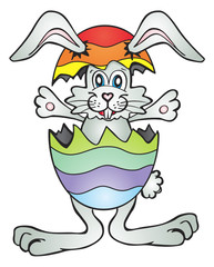 Cheerful bunny inside colorfull easter egg