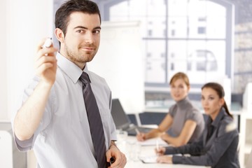 Young businessman presenting smiling