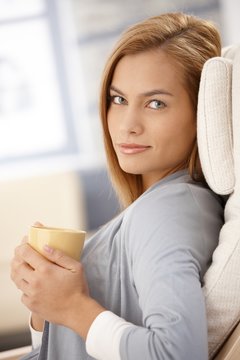Portrait of smiling woman with coffee cup