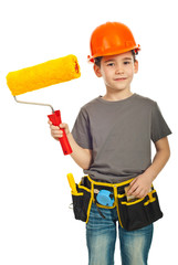 Happy kid boy holding paint roller
