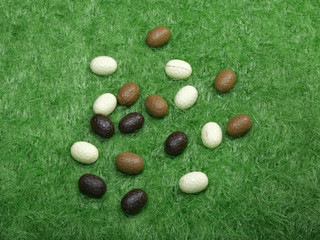 Easter eggs on fake green gras