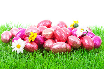 Pink easter eggs on grass