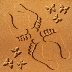 Traces of man and woman on sand