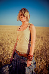 Image of young woman on wheat field