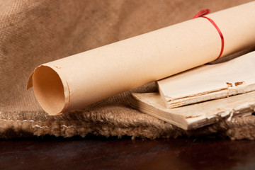 Old cumpled books and a paper scroll