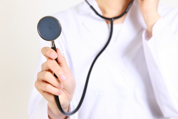 doctor auscultating with stethoscope/聴診器で聴診する医師
