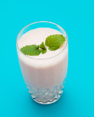 Strawberry milkshake on a blue background