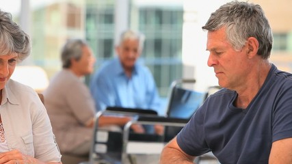 Elderly couple playing dominos - Powered by Adobe