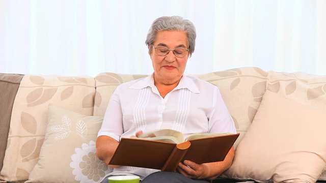 Woman looking at her photo album